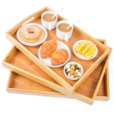 AKKAJJ front view of three beige bamboo serving trays showing clean design and versatility