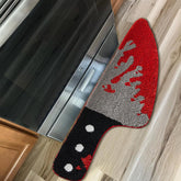 Aldopein front view of rug showing skull knife design and compact shape for dramatic entryways