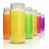 All About Juicing front packaging showing six clear glass bottles, organized and ready
