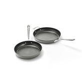 All-Clad HA1 fry pans with lids showing complete set and professional finish