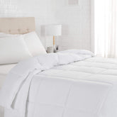Amazon Basics king comforter front view shows crisp white bedding and cozy appeal