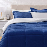 Amazon Basics comforter front view showing navy micromink and neat drape for a polished bed