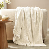 Amélie Home front view of ivory chenille throw showing chevron pattern and cozy appeal