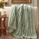 Amélie Home folded throw front view shows sage color and cozy appeal