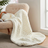 Amélie Home ivory throw folded showing neat edges and cozy look