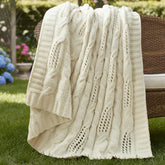 Amélie Home front view of ivory throw showing cable knit and elegant look