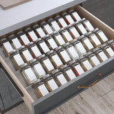Antimbee front view of expandable spice trays showing clean organization benefit