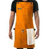 Asaya apron front view showing full coverage and organized pockets for convenience