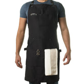 Asaya apron front view showing pockets and leather accents for organized convenience
