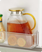 Baffect front view of glass pitcher showing slim profile and neat fridge fit