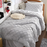 Bedsure comforter front view showing light grey tufted design and cozy appeal