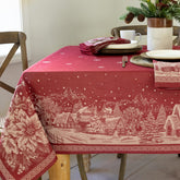 Benson Mills front view of Christmas Story tablecloth showing festive village design and elegant drape