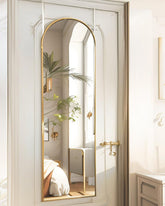 BEVERDY front view of arched full-length mirror showing elegant gold frame and clear reflection benefit
