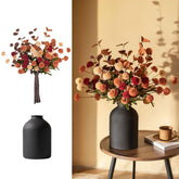 BLOSMON front view of centerpiece showing burnt-orange mums and black vase, adds instant warmth