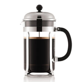 Bodum CHAMBORD front view showing polished steel frame and glass carafe, elegant countertop display