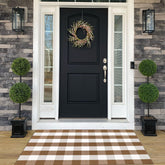 Bottalive front view of brown and white buffalo plaid rug enhancing curb appeal