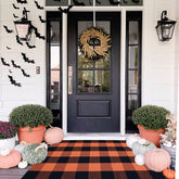 Bottalive front view of orange black plaid rug showing seasonal curb appeal