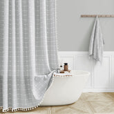 BTTN grey curtain front view showing embroidered plaid and elegant neutral benefit: elevates bathroom style