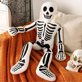 Bunny Chorus front view skeleton pillow showing friendly face and bold design for festive decor