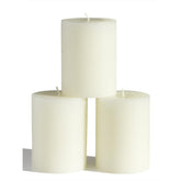 CANDWAX front view of three ivory 3x4 pillar candles for elegant decor