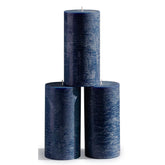 CANDWAX front view of three dark blue pillars showing rustic finish and neat packaging benefit