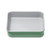 Caraway 9" square pan front view showing sleek ceramic finish and even edges for consistent baking