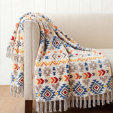 CASAAGUSTO front view showing colorful boho throw and tassels for instant style
