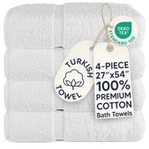 Chakir Turkish Linens front view of four white towels, clean hotel-style look