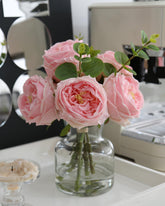 CHASMILE front view of pink roses in glass vase showing elegant centerpiece benefit