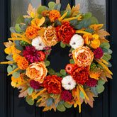 CHvista front door wreath with orange peony and burgundy dahlias creating a warm entrance