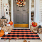 Ckorzen front view showing orange-black buffalo check and warm welcome