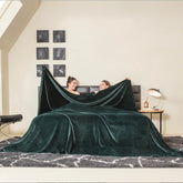 COOVA oversized blanket front view showing full forest green coverage and cozy appeal