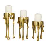 CosmoLiving front view of three gold candle holders showing modern silhouette and balance