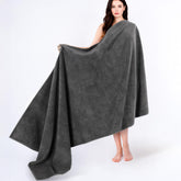 Cotton Paradise folded front view showing dark gray oversized towel and clean lines for neat storage