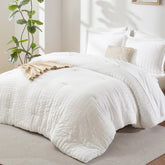 CozyLux comforter front view showing white seersucker texture and neat finish for a crisp bed look