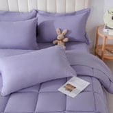 DOWNCOOL full set front view showing purple comforter and coordinated sheets, adds instant style