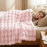 DREAMNINE front view of pink throw showing plush bubble texture and cozy appeal