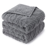 Drewin folded front view showing full queen blanket and elegant grey finish for cozy styling
