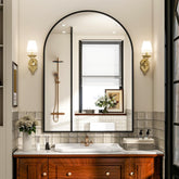 Easly arched mirror front view shows elegant black frame and bright reflection