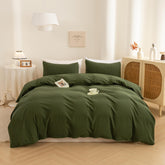ECOCOTT duvet cover front view showing avocado green and neat fit for a polished bed