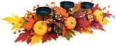 Eksen front view centerpiece showing three candle holders and harvest accents for warmth