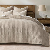 EverGrace king quilt front view showing elegant light taupe and neat drape for stylish bedding