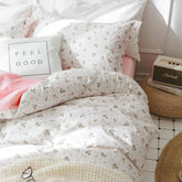 Faincy front view of full-size comforter set showing floral design and easy styling benefits