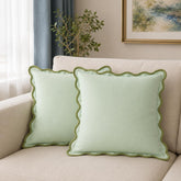 Folkulture front view of sage green 20x20 covers showing clean look and cozy feel