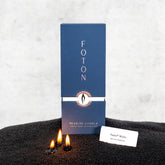 Foton front packaging for 18 oz black pearled candle sand, clear kit benefits