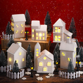 Fovths front view of porcelain houses showing warm LED glow and festive charm