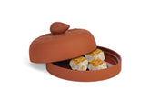 Fox Run garlic baker front view showing terra cotta finish and garlic handle; stylish serving