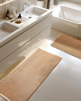 Furicher front view of brown and white two-piece mat set showing style and fit