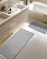 Furicher front view of both grey and white waffle bath mats showing sizes and design benefit