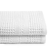 GILDEN TREE front view of folded white waffle towels showing classic style and convenience